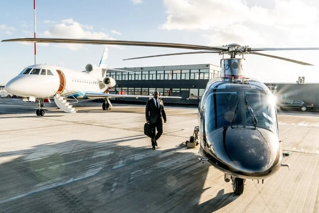 Business executive travelling by private jet and helicopter