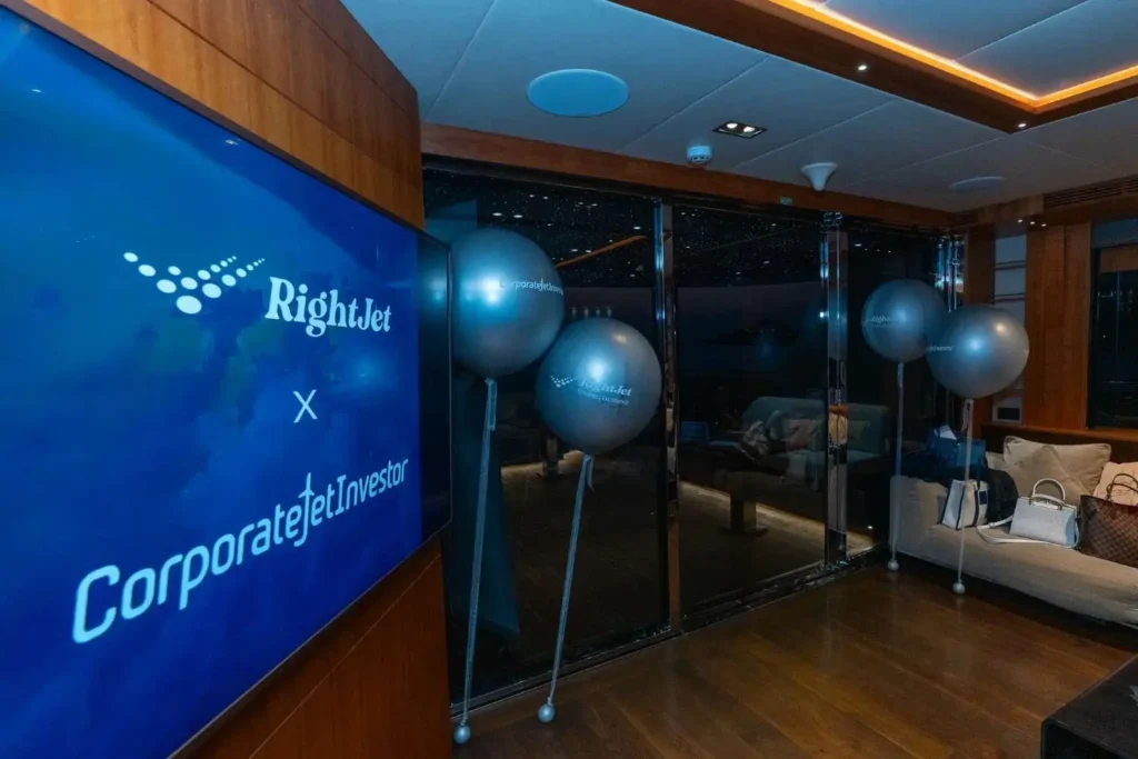 RightJet and Corporate Jet Investor Dubai 2026 lead sponsor branding at the Santorini reception